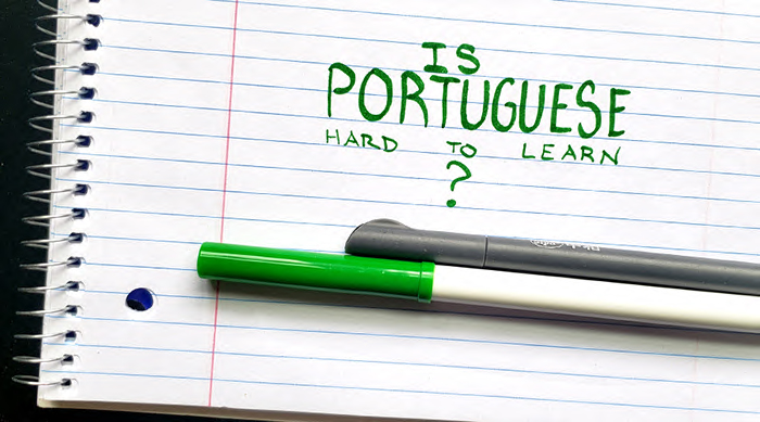 Paper with the words "Is Portuguese Hard to Learn?" written in green marker