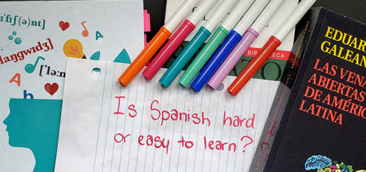 The words "Is Spanish hard or easy to learn" written on paper with markers