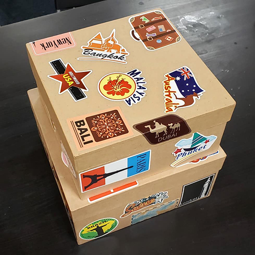Gift packaging idea for travel lovers. Two small boxes with travel stickers on them